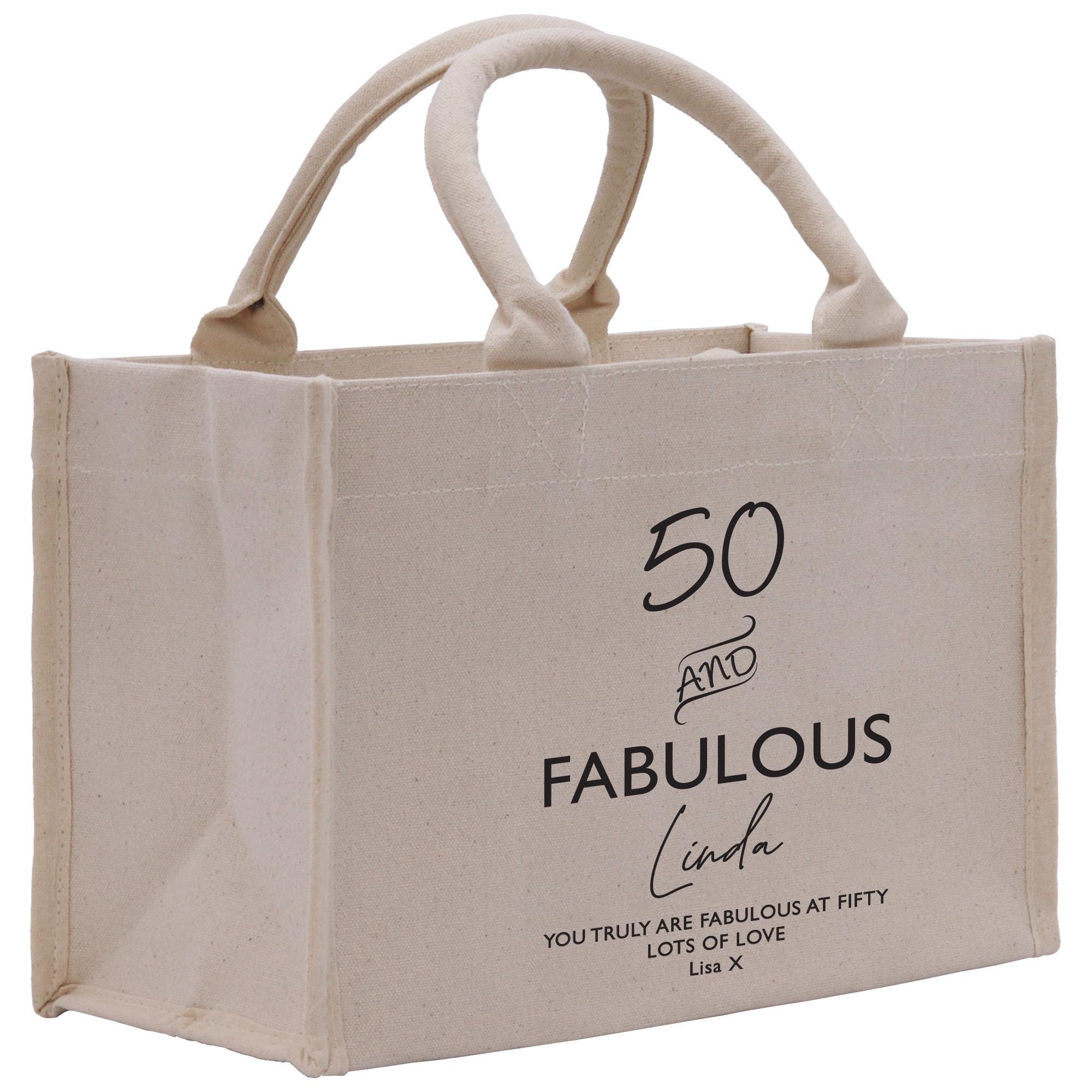 a white shopping bag with the words fabulous printed on it