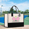 a white and black shopping bag with a tennis court in the background