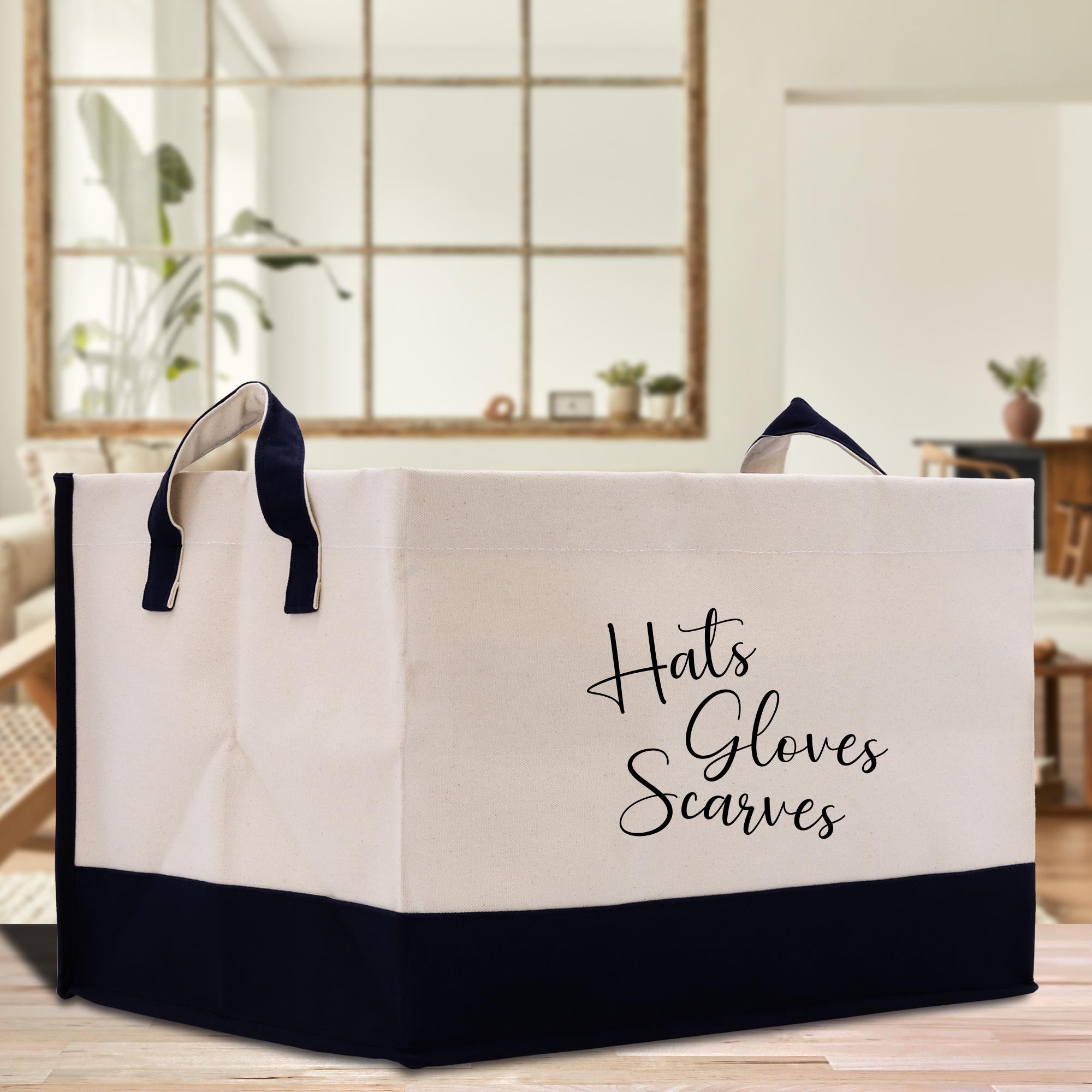 a white and black shopping bag sitting on top of a wooden table