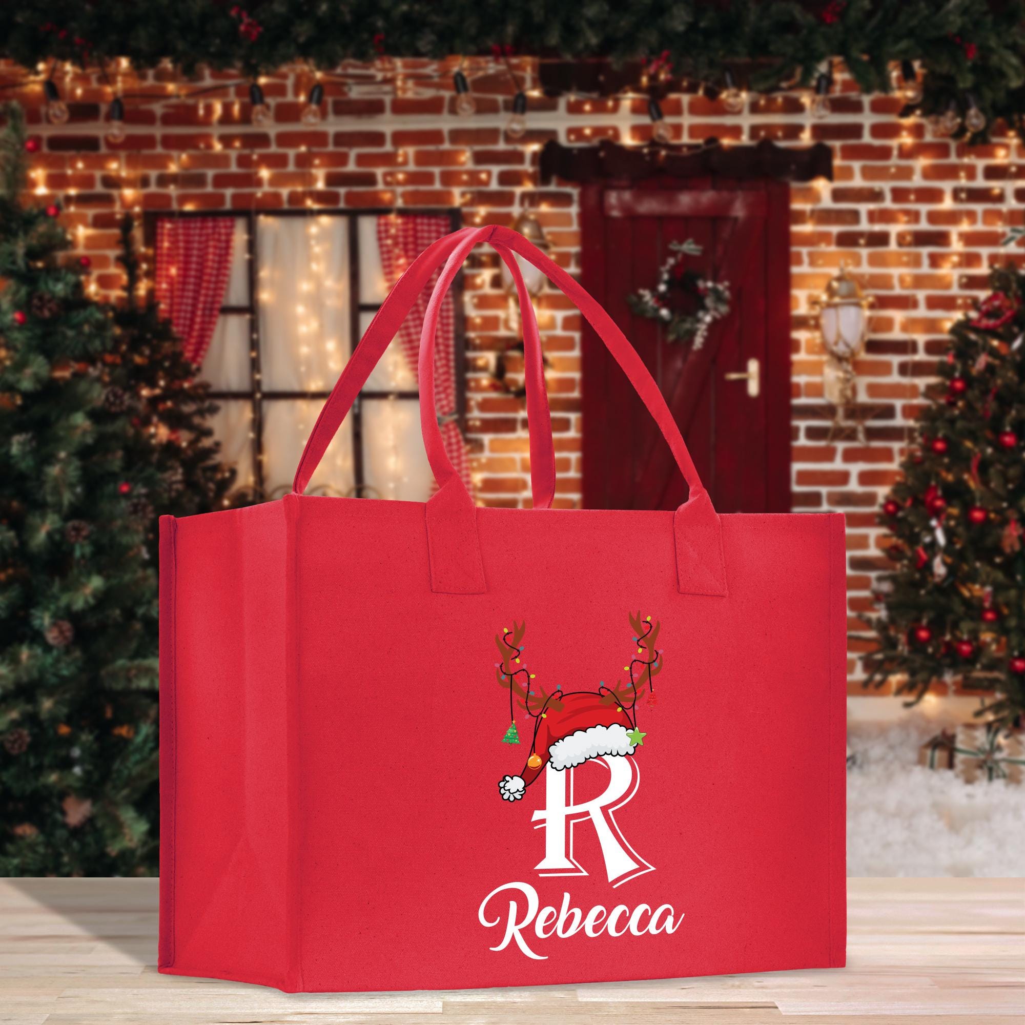 a red shopping bag with a reindeer on it