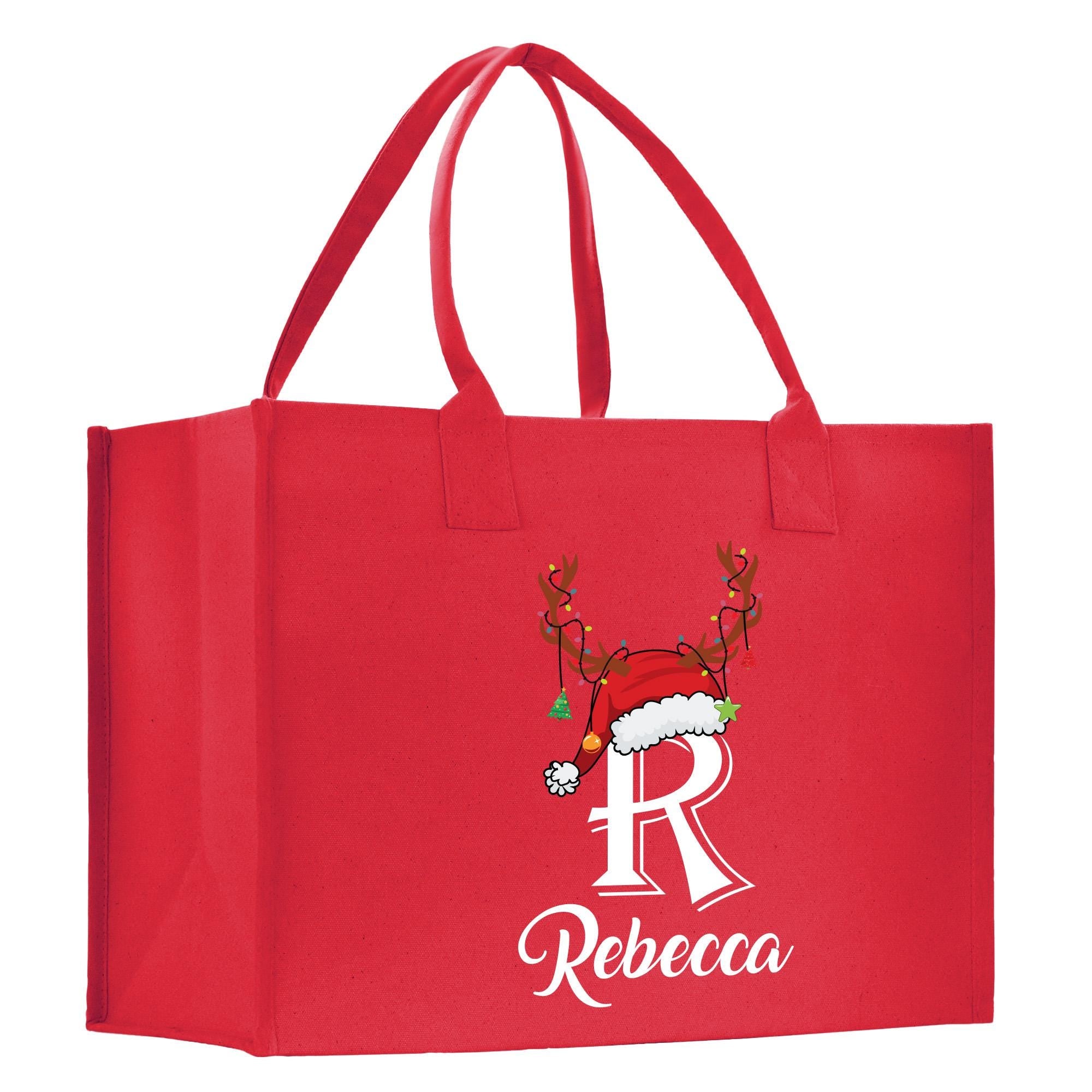 a red shopping bag with a reindeer on it