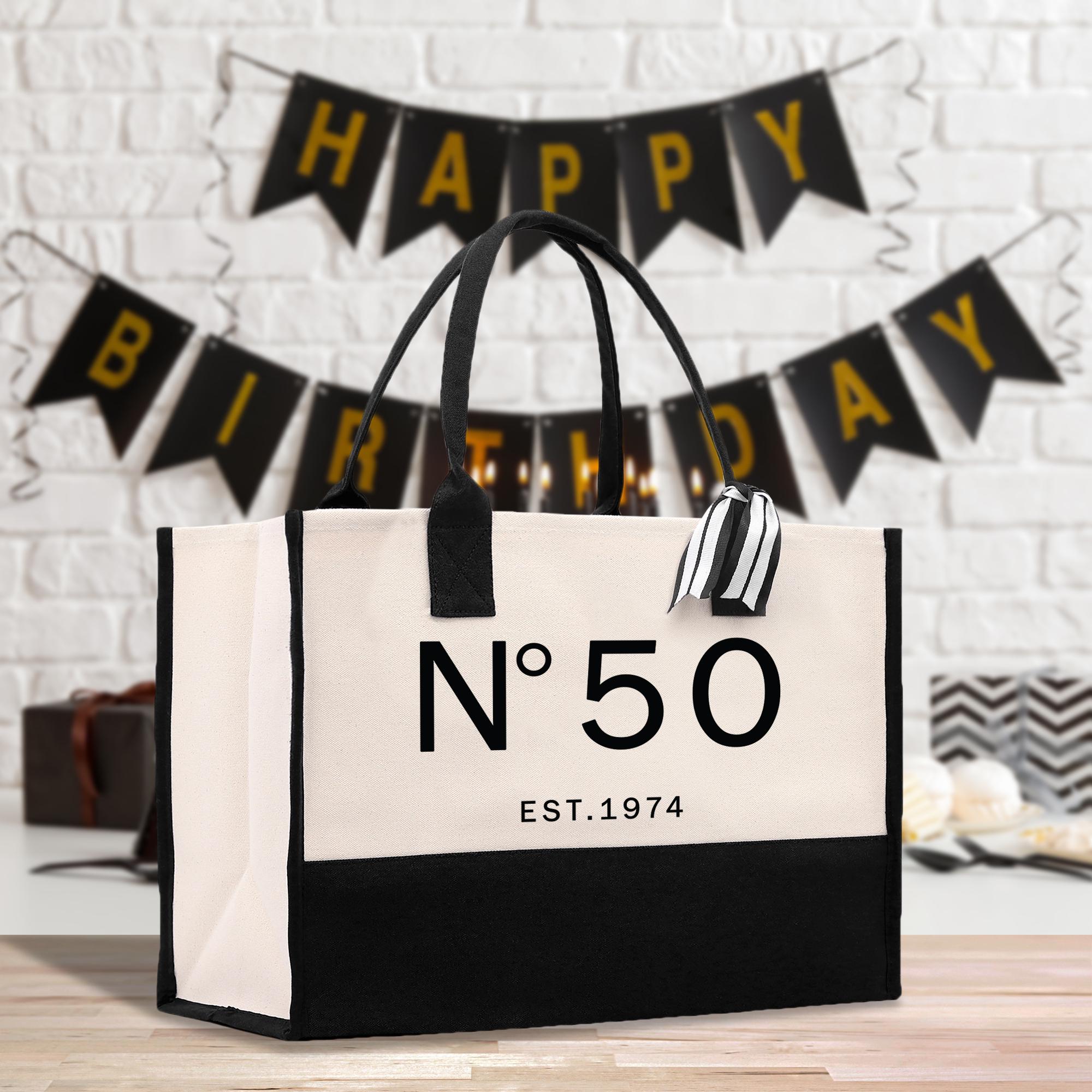 a black and white bag with a happy birthday sign on it