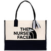 a black and white tote bag with the words the nurse face on it