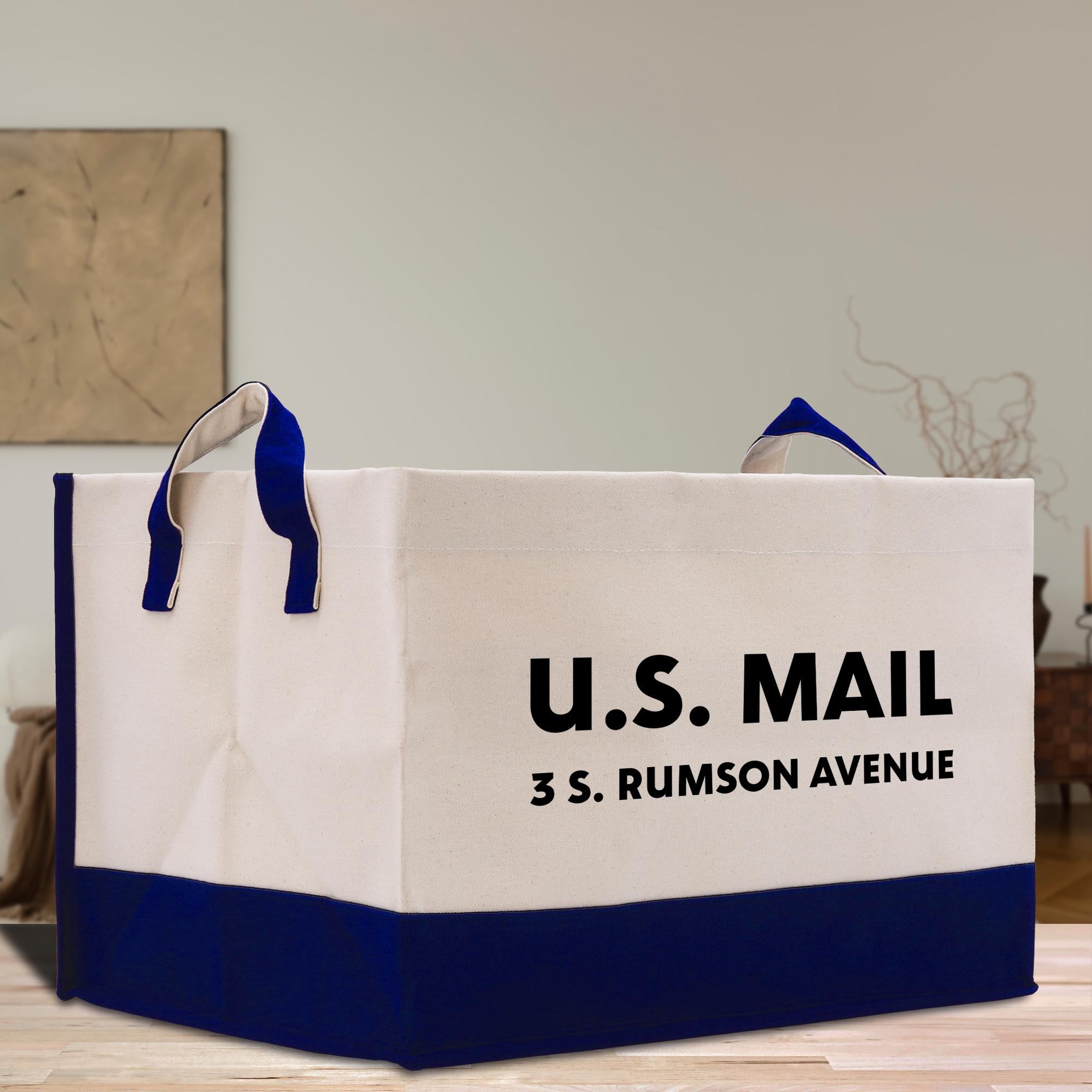 a white and blue shopping bag sitting on top of a wooden table