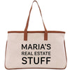 a white bag with a brown handle that says maria's real estate stuff