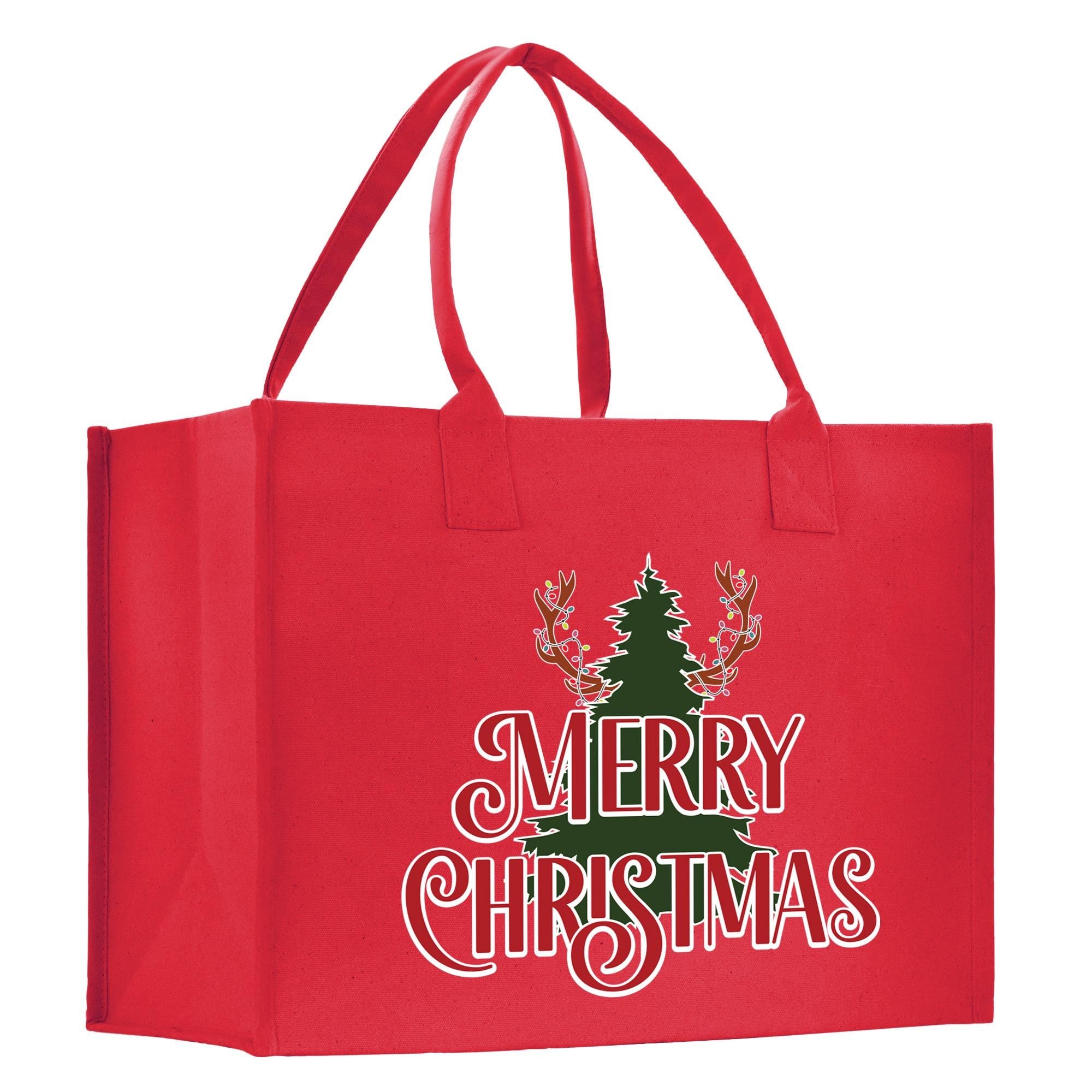 a red shopping bag with a christmas tree on it