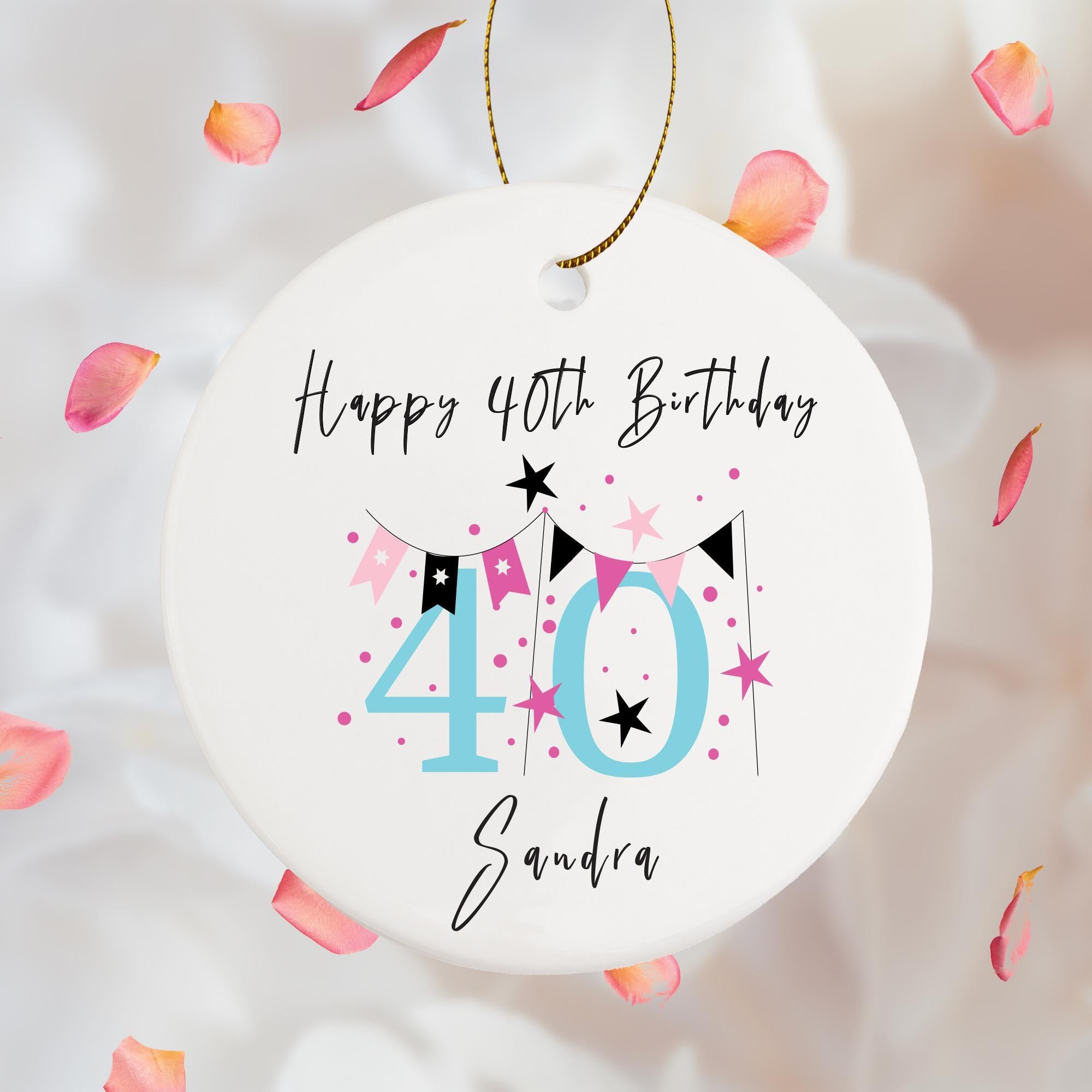 a white birthday ornament with a pink and black forty forty forty forty forty