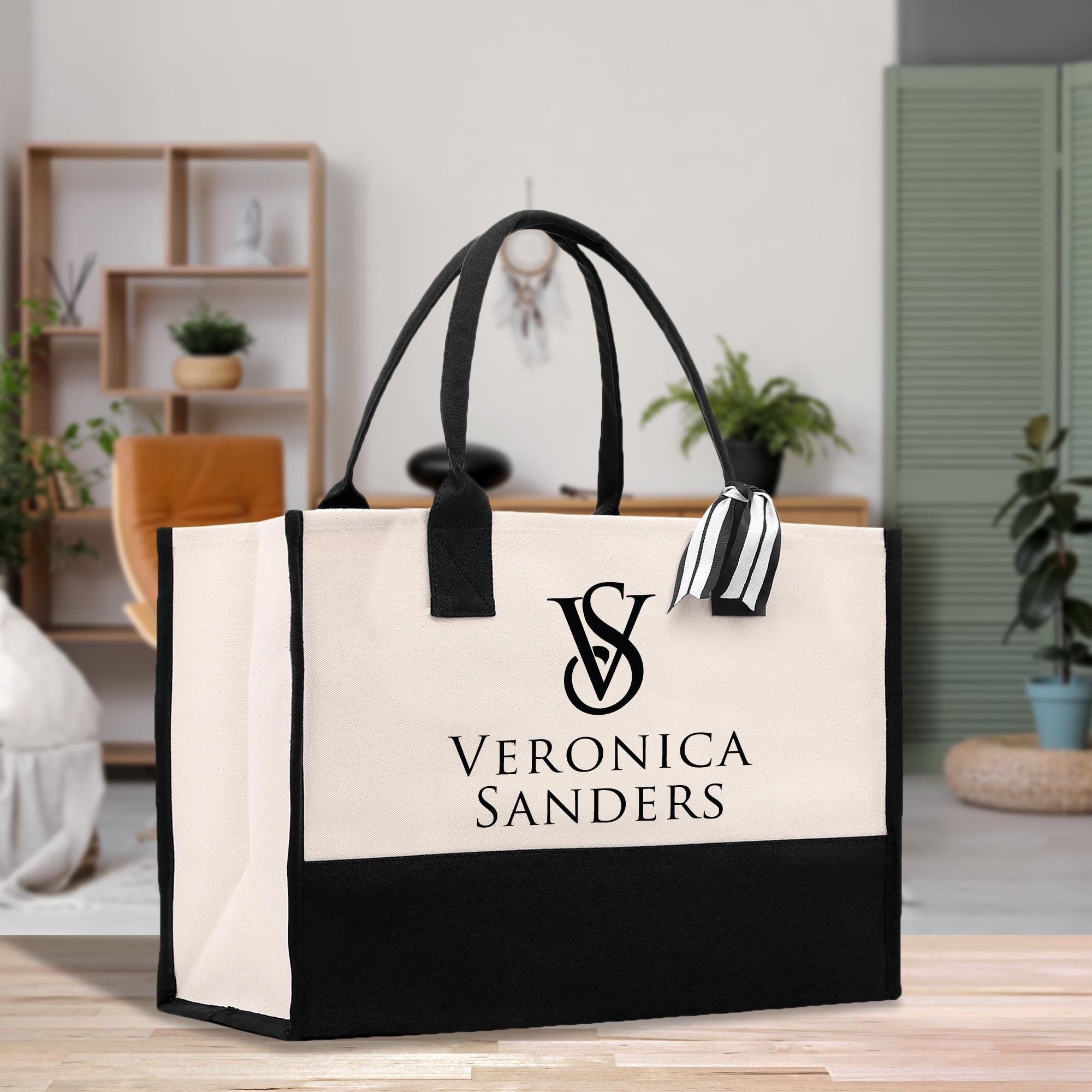 a black and white bag sitting on top of a wooden table