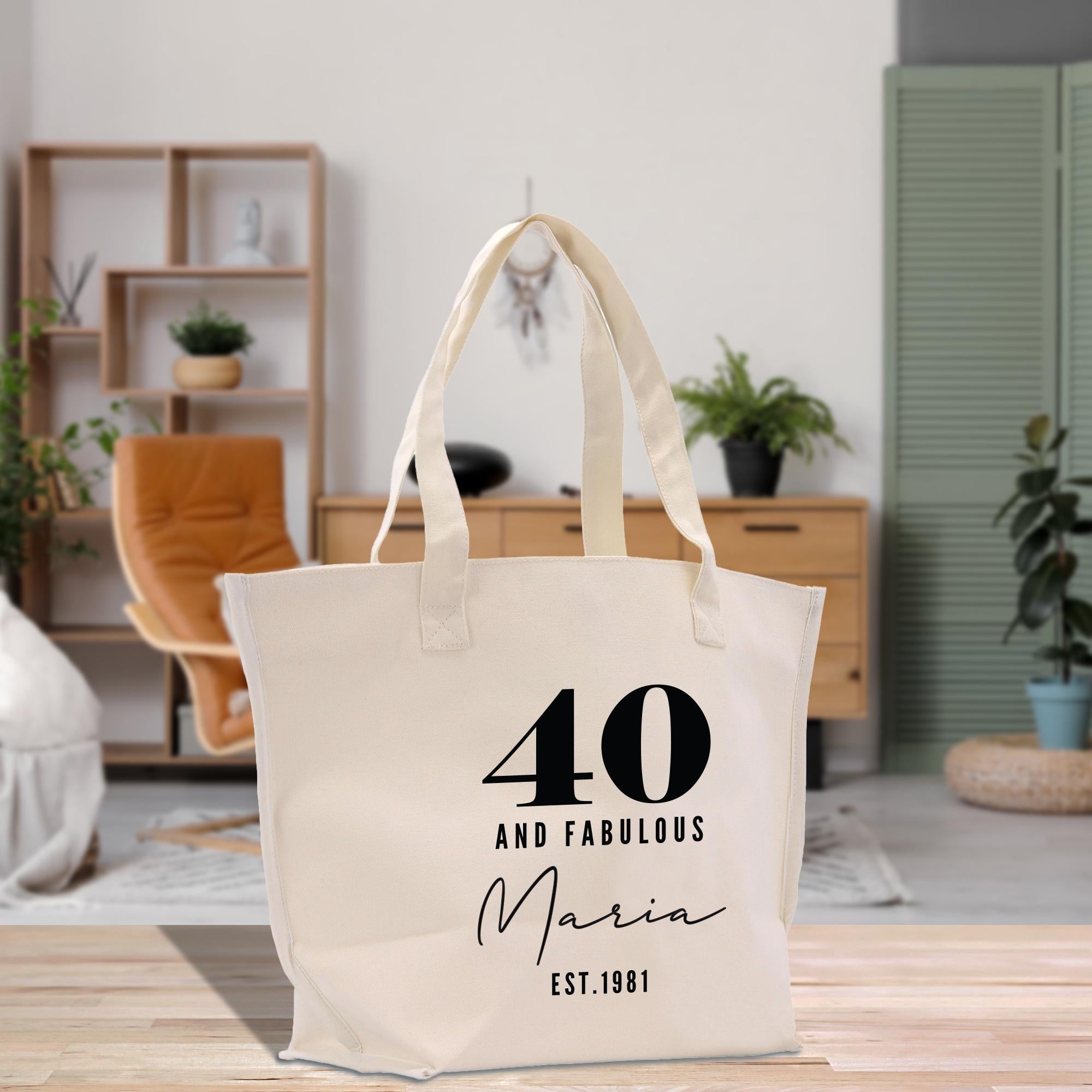 a white tote bag sitting on top of a wooden table