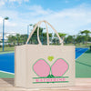 a shopping bag with a tennis court in the background