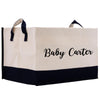 a white and black shopping bag with the word baby carrier printed on it