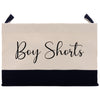 a canvas bag with a black and white stripe and the word boy shorts on it