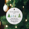 a personalized ornament hanging from a christmas tree