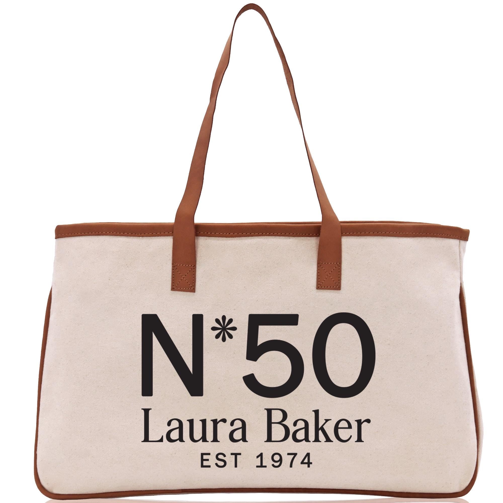 a white bag with a brown leather handle