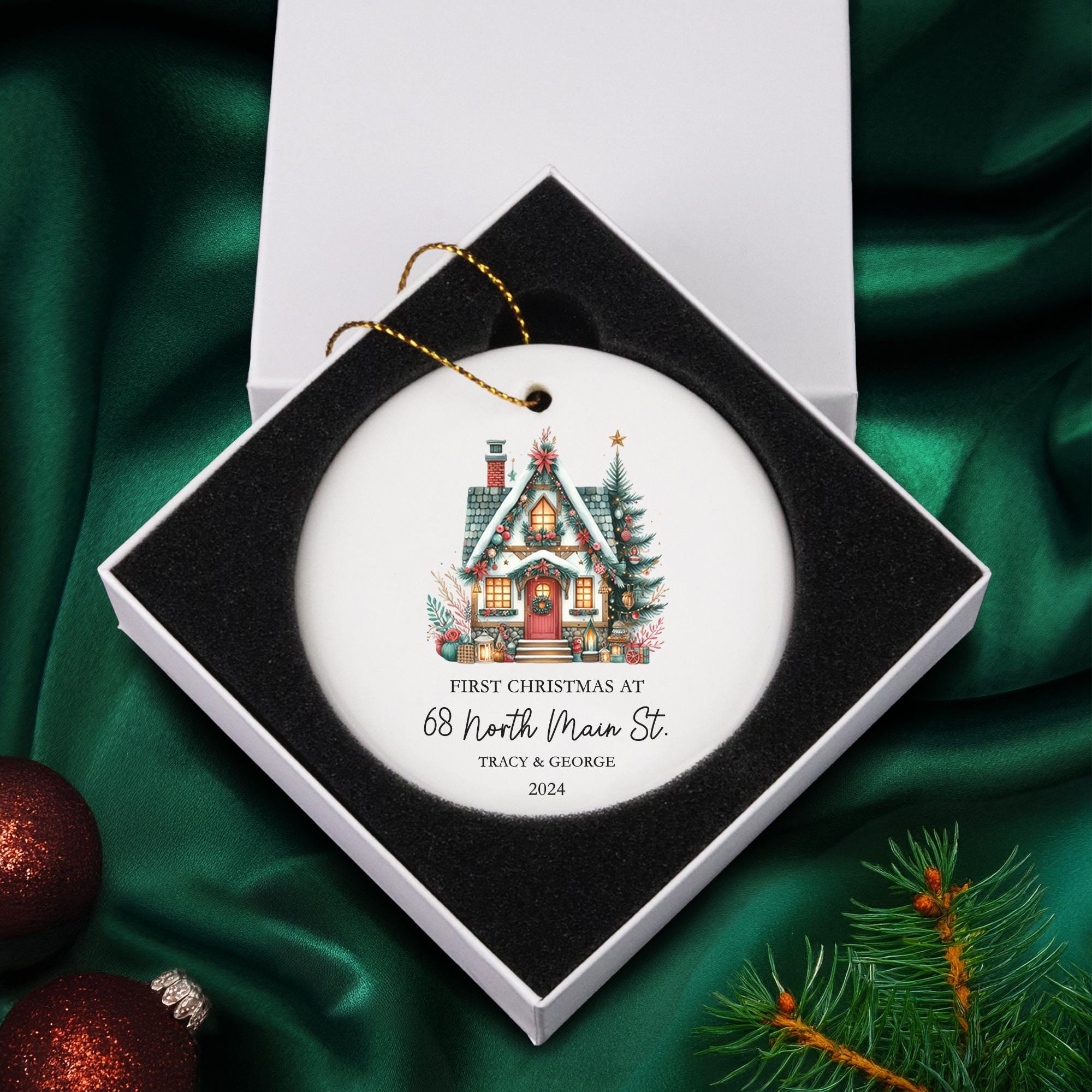 a christmas ornament with a house on it