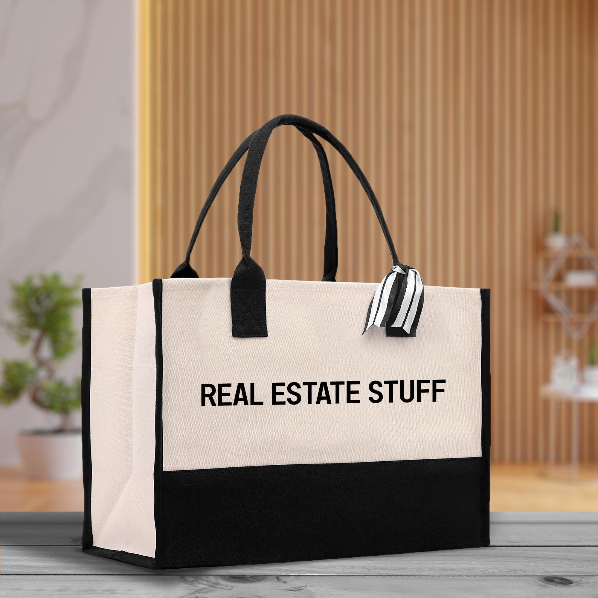 a black and white bag with the words real estate stuff on it