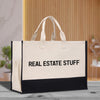 a black and white bag with the words real estate stuff on it