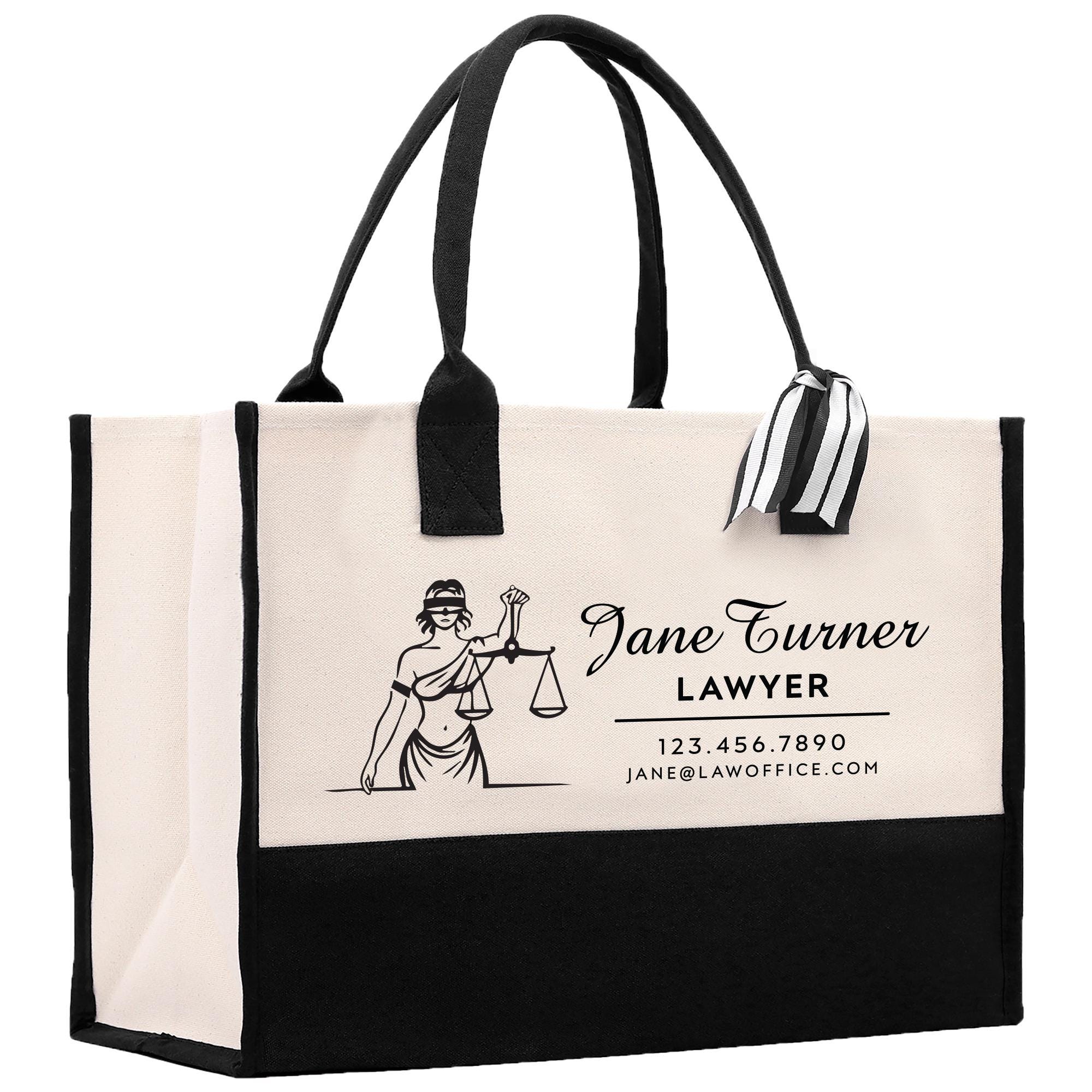 a white and black bag with a lady justice logo