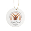 a ceramic ornament with a rainbow design