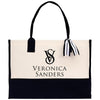 a black and white tote bag with a black and white striped handle