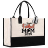 a black and white tote bag with a football mom on it