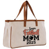 a canvas tote bag with a football mom on it