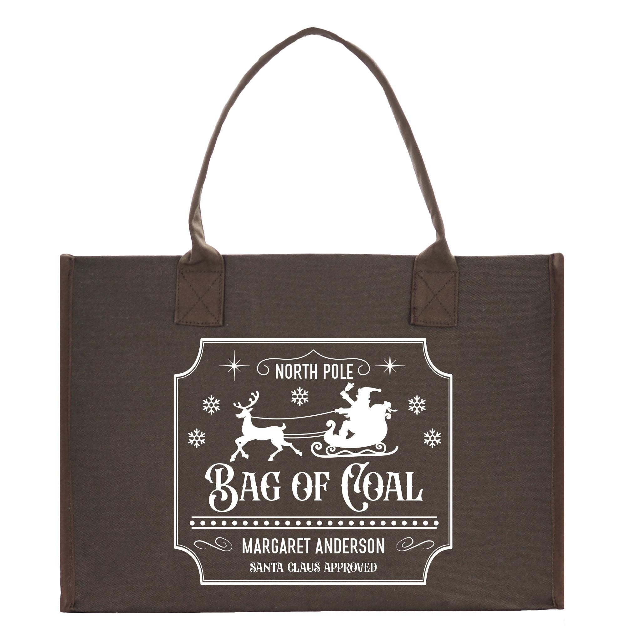 a bag of coal with a santa on a sleigh