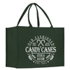 a green shopping bag with the words candy canes inside