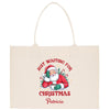 a white shopping bag with a santa clause on it