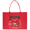 a red shopping bag with a reindeer on it