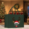 a green shopping bag with a reindeer's face on it