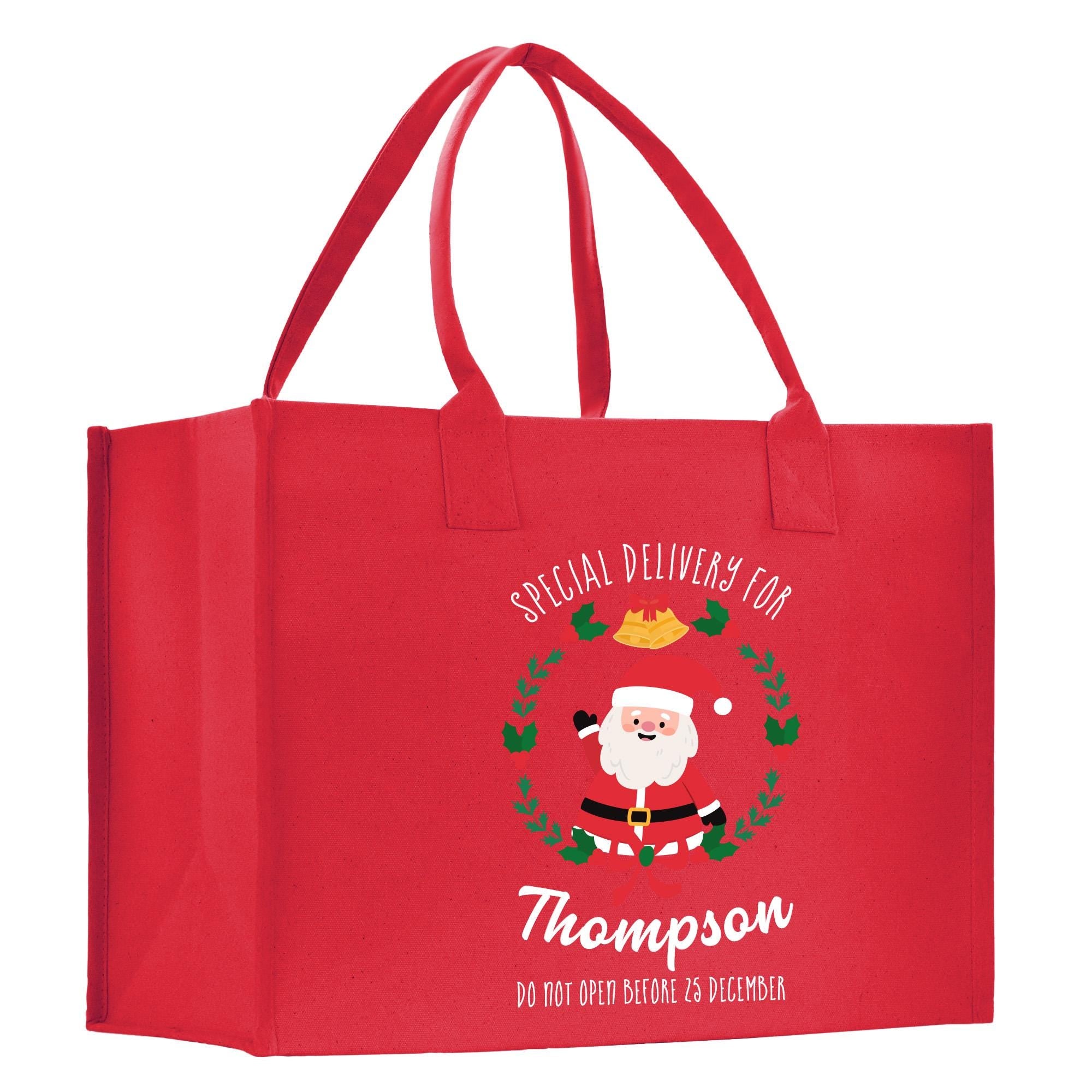 a red shopping bag with a santa clause on it