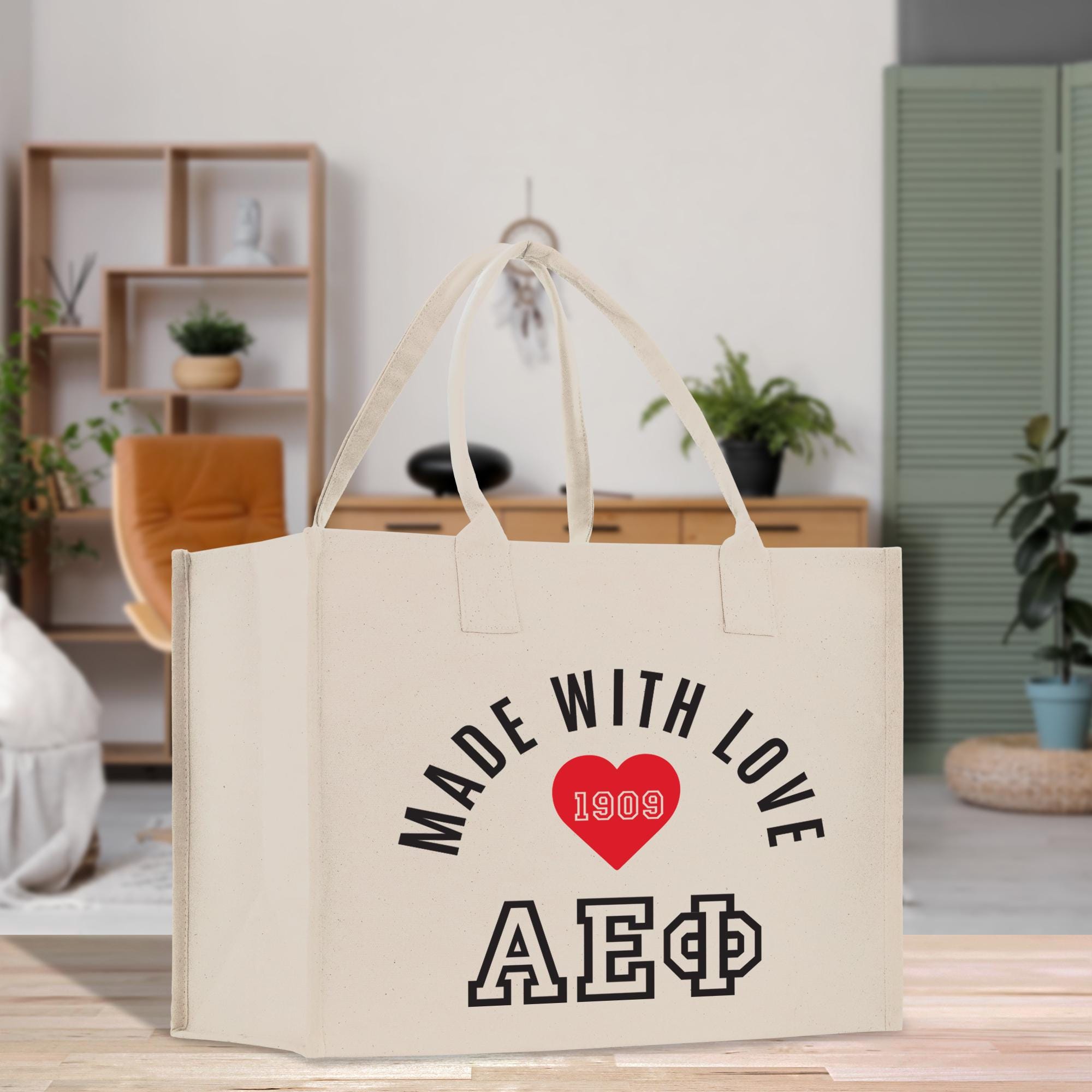 a white bag with a red heart on it that says made with love aep