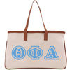 a white and blue tote bag with letters on it