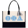 a tote bag with a tassel hanging from it