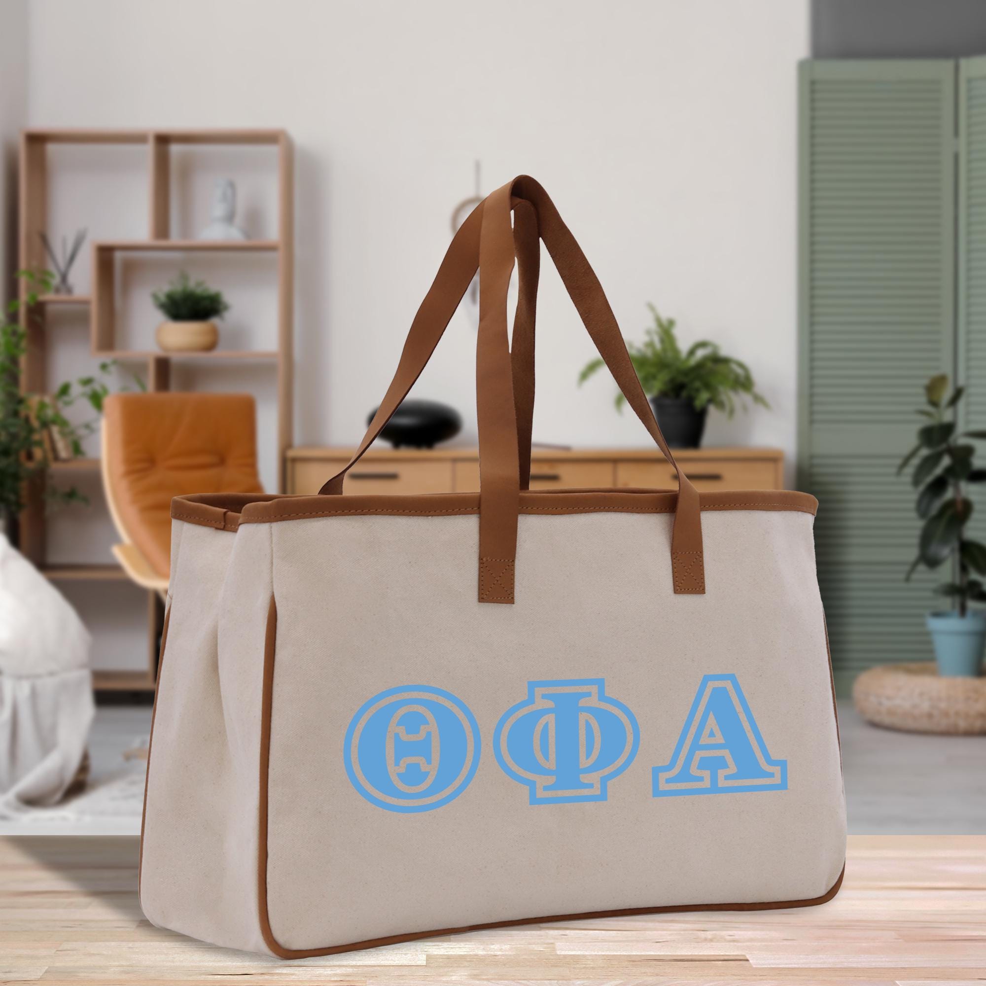 a canvas bag with greek letters on it