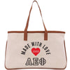 a canvas bag with a heart and the words made with love