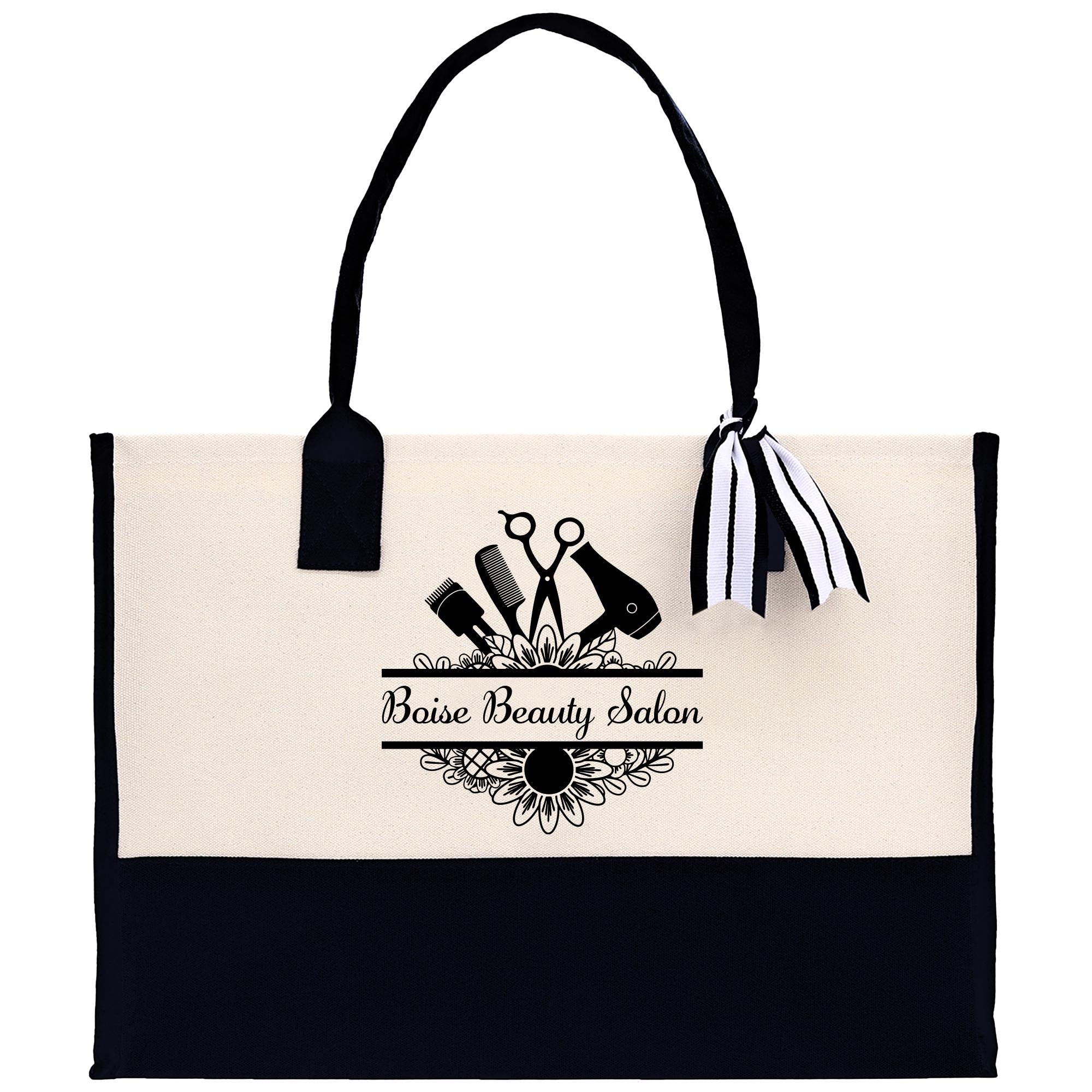 a black and white tote bag with scissors and a bow