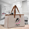 a canvas bag with a woman's hair logo on it