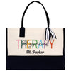 a white and black tote bag with the words therapy on it