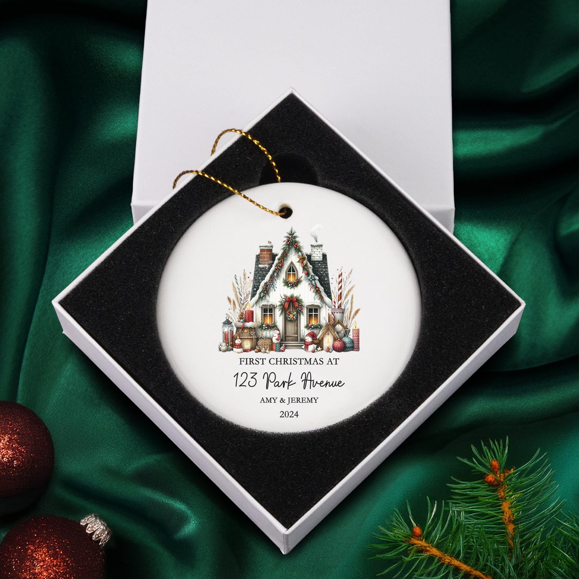 a christmas ornament with a picture of a house on it