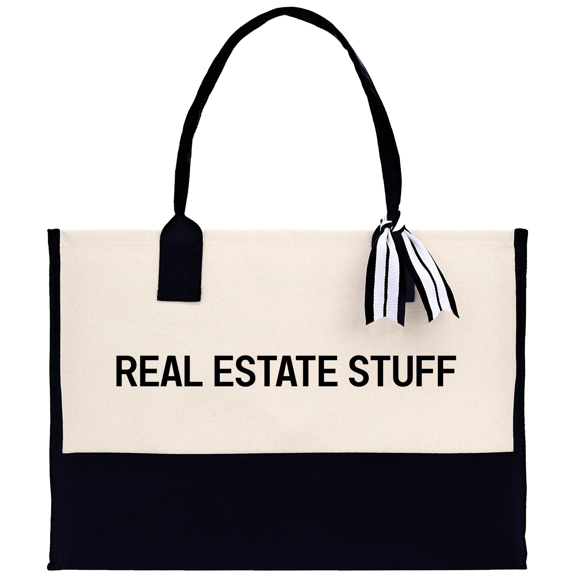 a black and white tote bag with the words real estate stuff on it