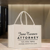 a white bag sitting on top of a wooden table