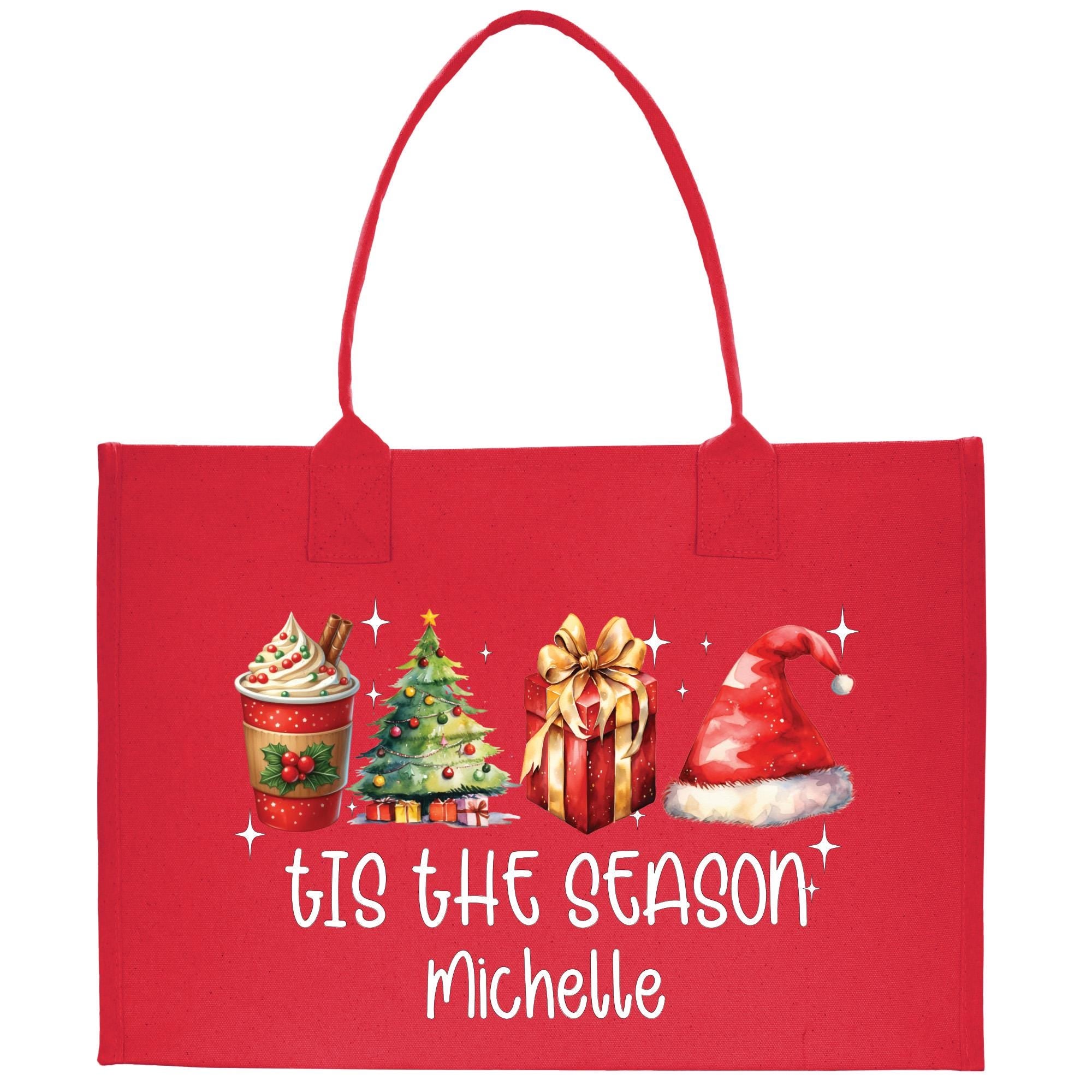 a red shopping bag with a christmas scene on it