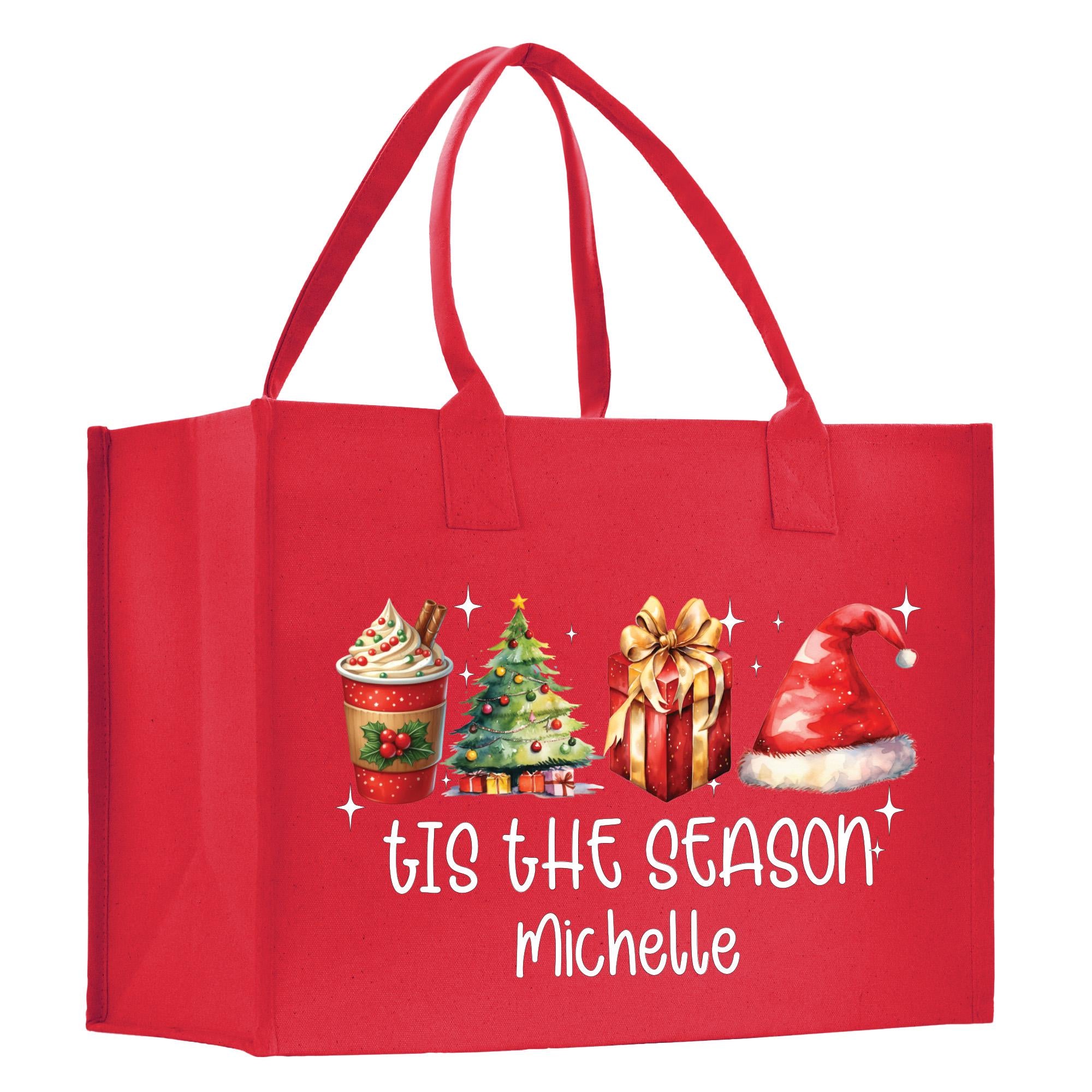 a red shopping bag with a christmas scene on it