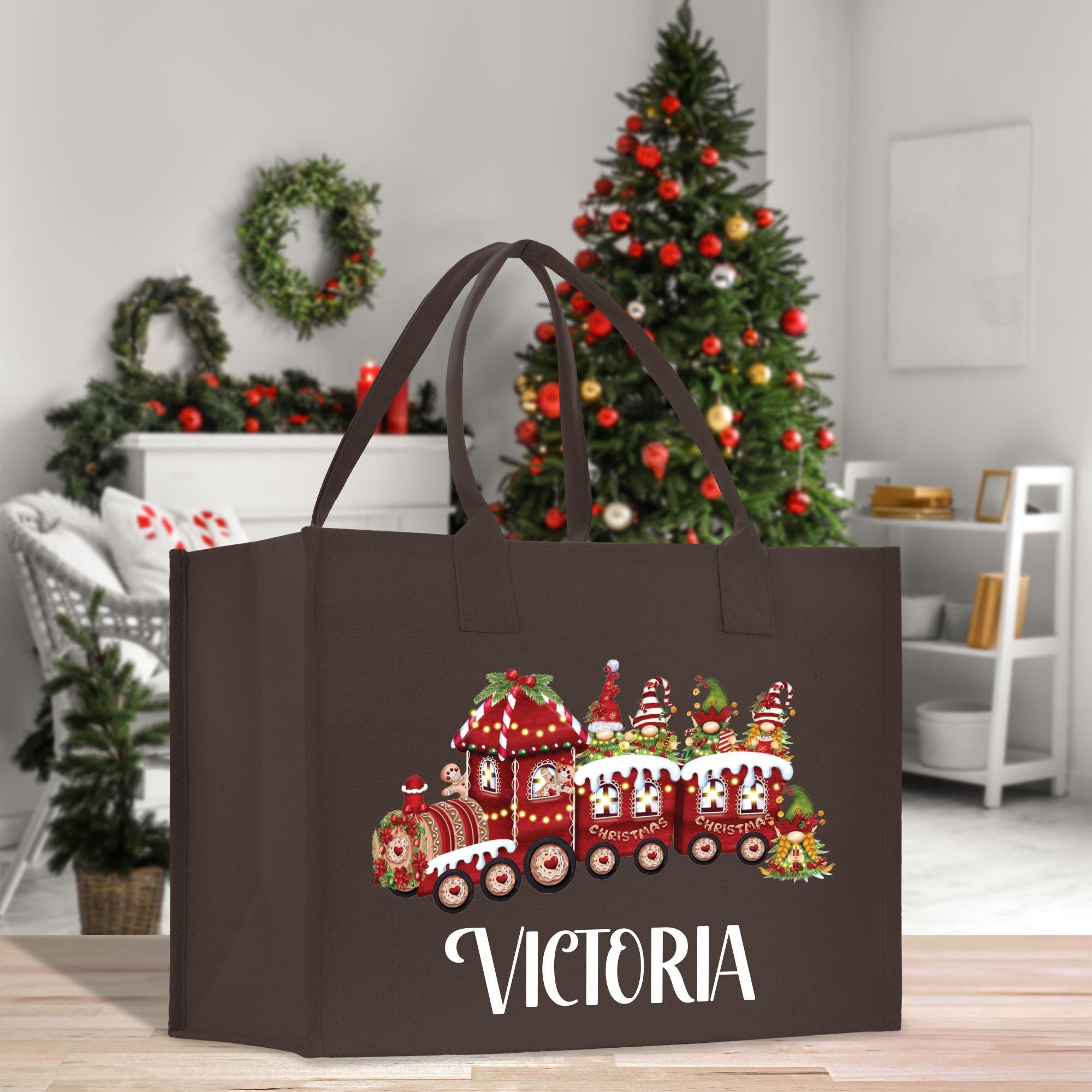 a brown shopping bag with a christmas train on it