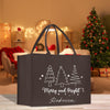 a black shopping bag with a christmas tree on it