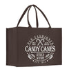 a brown shopping bag with the words candy canes inside