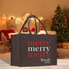 a black shopping bag with a merry merry message on it