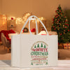 a white christmas shopping bag sitting on a table